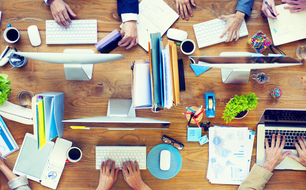 Photodune 8797917 Group Of Business People Working On An Office Desk M 1024x635